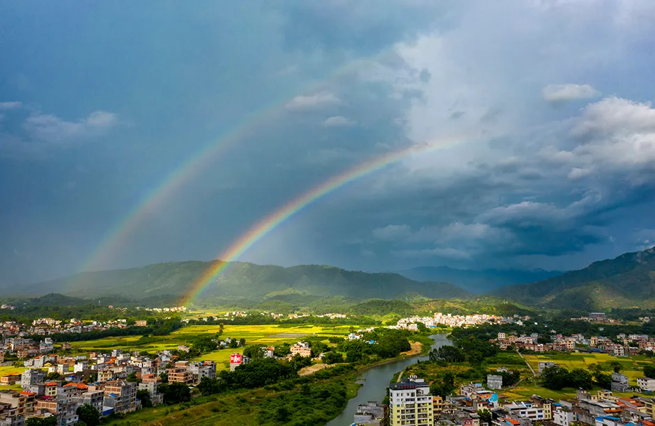 WUZHOU, CHINA - JULY 07: A rainbow appears in the sky over Cangwu county on July 7, 2021 in Wuzhou, Guangxi Zhuang Autonomous Region of China. Slight Heat, the 11th solar term in the Chinese lunar calendar, falls on July 7 this year. (Photo by VCG/VCG via Getty Images)