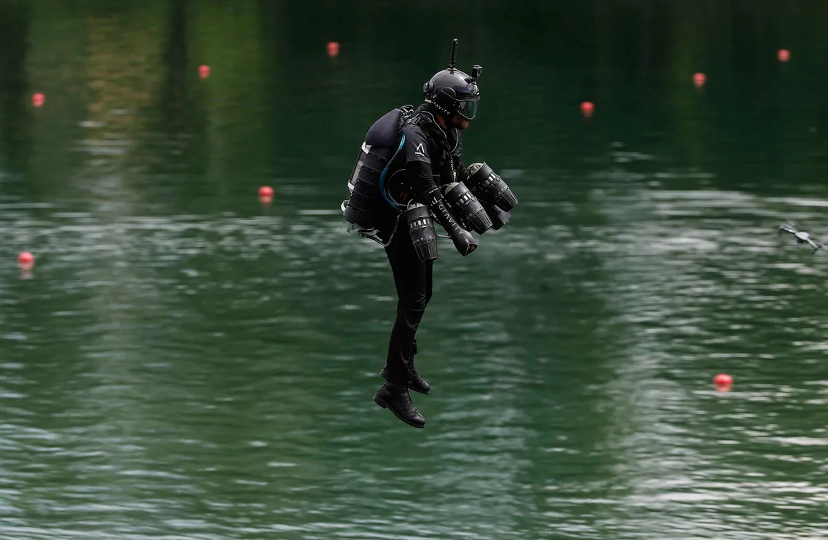 Richard Browning hovering above water in a jet suit
