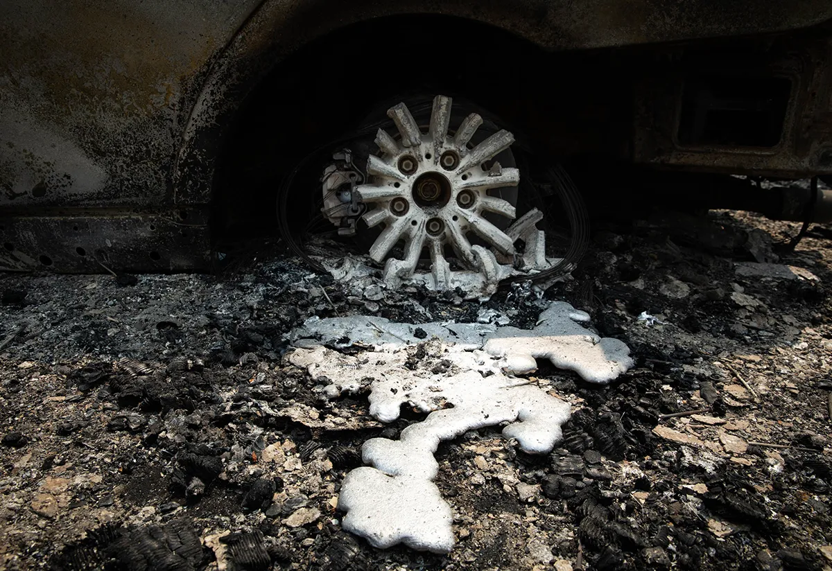 GREENVILLE, CA - AUGUST 08: A tire and wheel melted from the Dixie Fire on August 8, 2021 in Greenville, California. The Dixie Fire, which has incinerated more than 463,000 acres, is the second largest recorded wildfire in state history and remains only 21 percent contained. (Photo by Maranie R. Staab/Getty Images)
