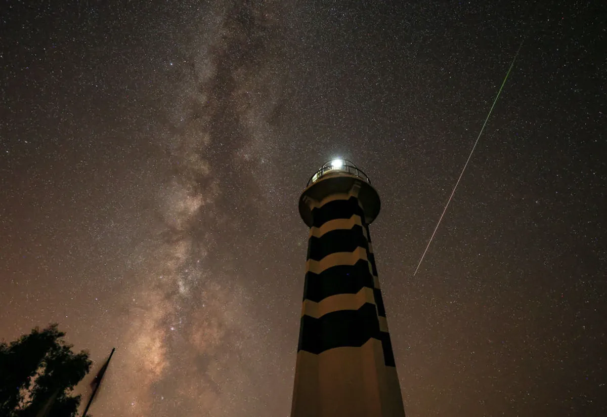 IZMIR, TURKEY - AUGUST 13: A Perseid meteor streaks across the night sky over Izmir, Turkey on August 13, 2021. (Photo by Mahmut Serdar Alakus/Anadolu Agency via Getty Images)