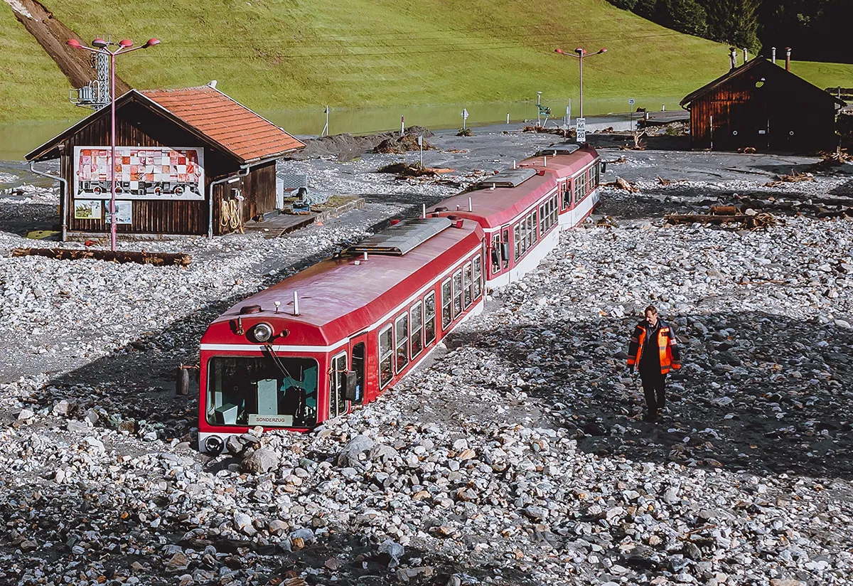 TOPSHOT - A stucked train after flooding is pictured in Wald im Pinzgau near Salzburg, Austria, on August 17, 2021. - Storms have battered large parts of Austria since late August 16 with landslides and flooding hitting especially Austrias western regions of Pinzgau and Pongau in the state of Salzburg, bordering Germany. Some 100 people stuck in cars as landslides hit roads had to be rescued, while three people have been injured. - Austria OUT (Photo by JFK / various sources / AFP) / Austria OUT (Photo by JFK/EXPA/AFP via Getty Images)
