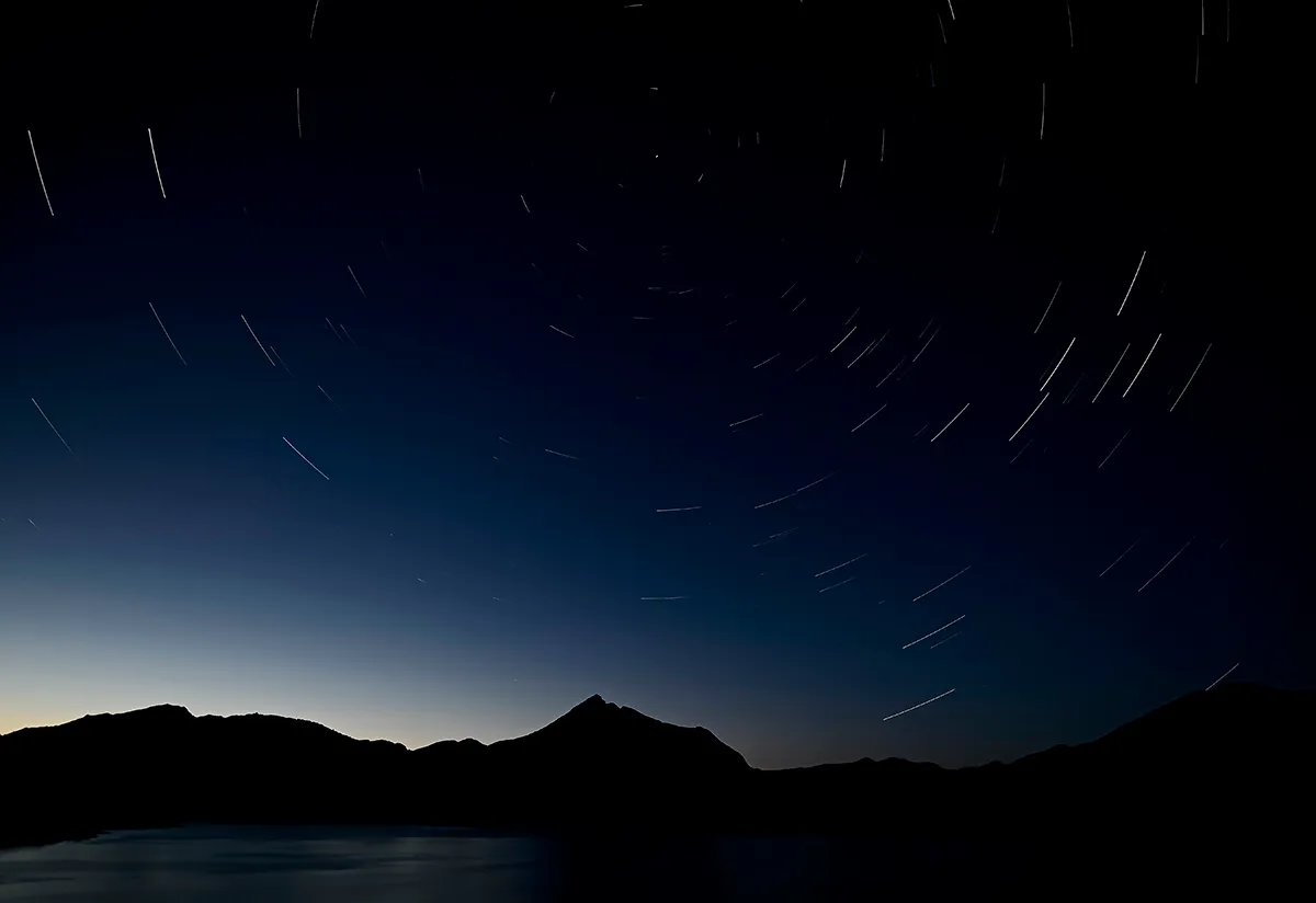 PORMA LAKE, SPAIN - AUGUST 05: (EDITOR'S NOTE: The image has been created with photographs in a multiple exposure) Meteors along the Milky Way en the sky on August 05, 2021 in Porma Lake, Leon, Spain. Perseids can be seen between the days of July 17 to August 24 of each year. The most optimal day is August 11. (Photo by Samuel de Roman/Getty Images)
