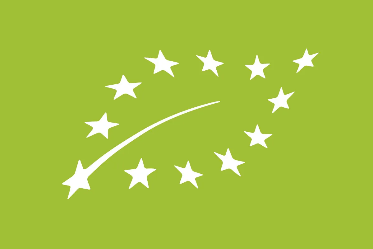The EU's organic logo, the outline of a leaf made up of stars on a green background