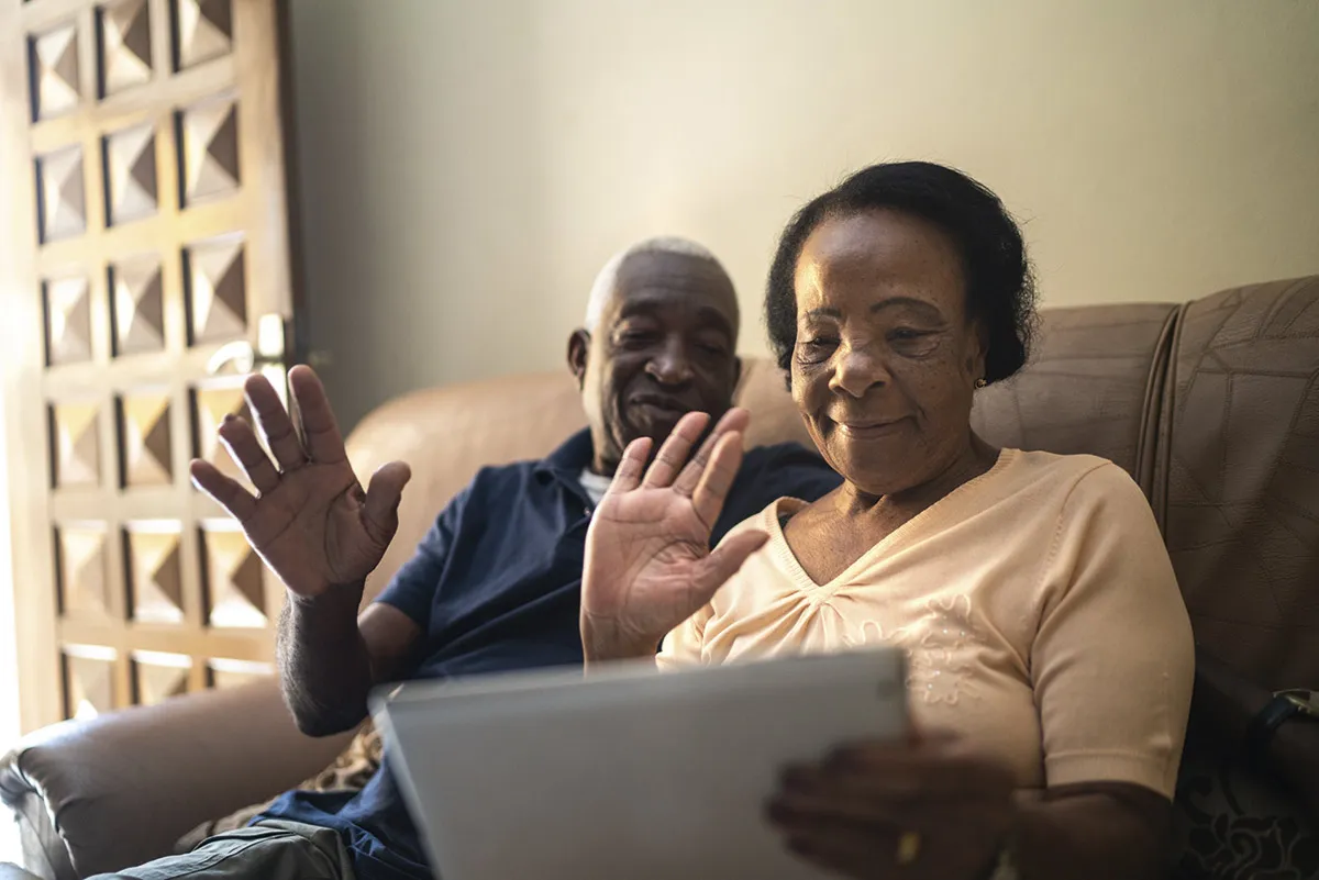 An elderly couple using a tablet for a video call © Getty Images