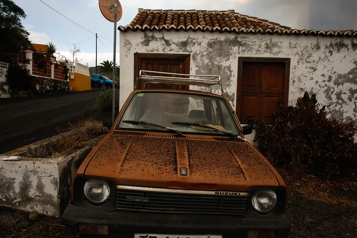 LA PALMA, SPAIN - SEPTEMBER 20: Volcano ash on the hood of a car in the area of Los Llanos, on September 20, 2021 in El Paso, La Palma, Santa Cruz de Tenerife, Canary Islands, Spain. The volcanic eruption began yesterday at 16:00 in the area of Cabeza de Vaca (La Palma). At least 15 homes were affected by the eruption early Monday and more than 5,000 people have been evacuated so far. Experts do not know when this eruption will end, which has left temperatures of 1,075 ° C in the rivers of lava from the volcano. (Photo By Kike Rincon/Europa Press via Getty Images)