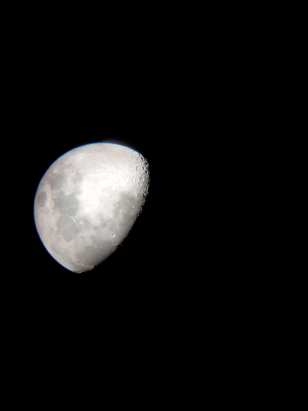 A photo of the Moon taken with a smartphone down a telescope eyepiece © Sara Rigby