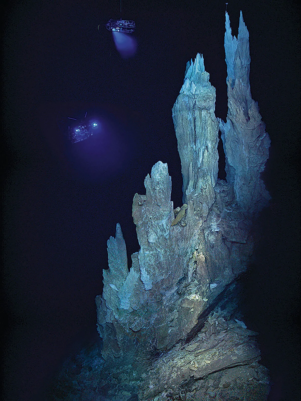 A 'white smoker', an alkaline hydrothermal vent. It is a rocky outcrop that points upwards like a stalagmite © D Kelley/M Elend/UW/URI-IAO/NOAA