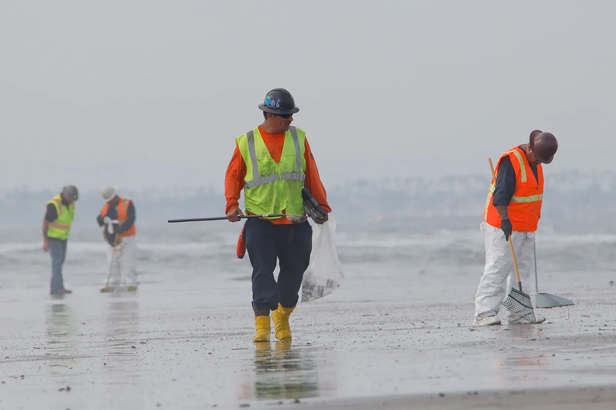 Mandatory Credit: Photo by Ron Lyon/ZUMA Press Wire/Shutterstock (12524405b) Environmental volunteers continue cleanup oil and residue that has washed ashore at Bolsa Chica State Beach. The pipeline oil spill has resulted in beach closures along a twenty mile stretch of Orange County. Oil Spill Off California Coast Threatens Wildlife, Huntington Beach, USA - 04 Oct 2021