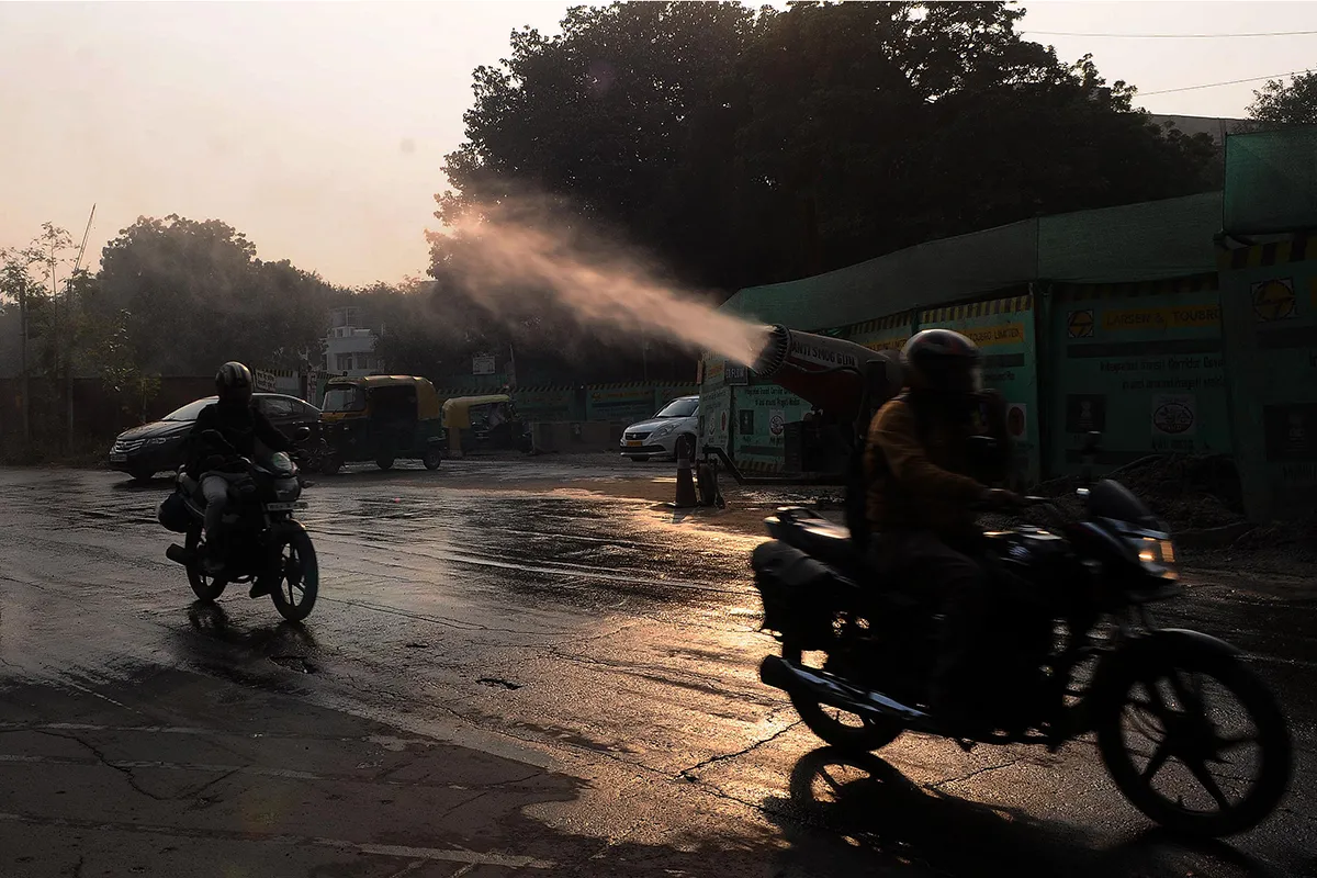 Anti Smog Gun spray water to reduce Smog at Mathura Road near Pragati Maidan construction site on November 16, 2021 in New Delhi, India. (Photo by Mohd Zakir/Hindustan Times via Getty Images)