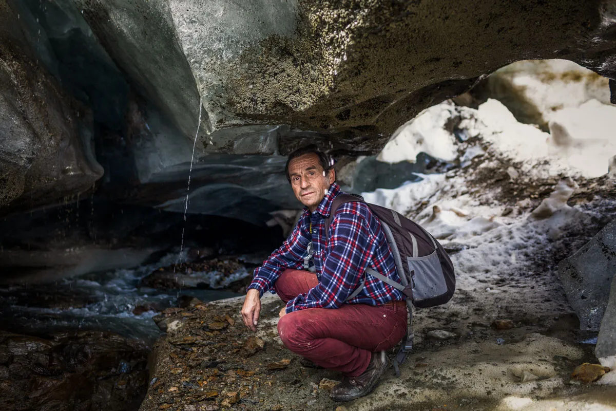The glaciologist Giuseppe Cola, 60, inside an endoglacial stream in the Eastern Forni glacier, Valfurva.