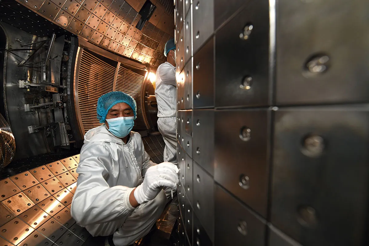 The team at China’s EAST reactor inspect and adjust the device ahead of its record-breaking demonstration in June 2021 © Shutterstock