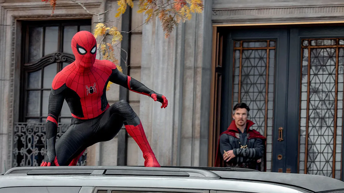 Tom Holland as Spider-Man perched on top of a car, with Benedict Cumberbatch as Doctor Strange