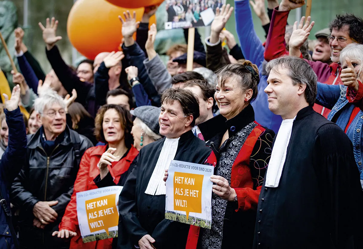 Urgenda’s campaigners outside the Dutch Supreme Court ahead of their landmark victory in 2019 © Getty Images