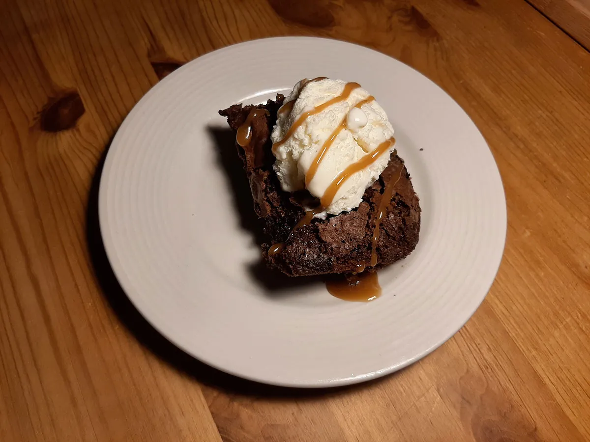Chocolate brownie with ice cream and salted caramel sauce