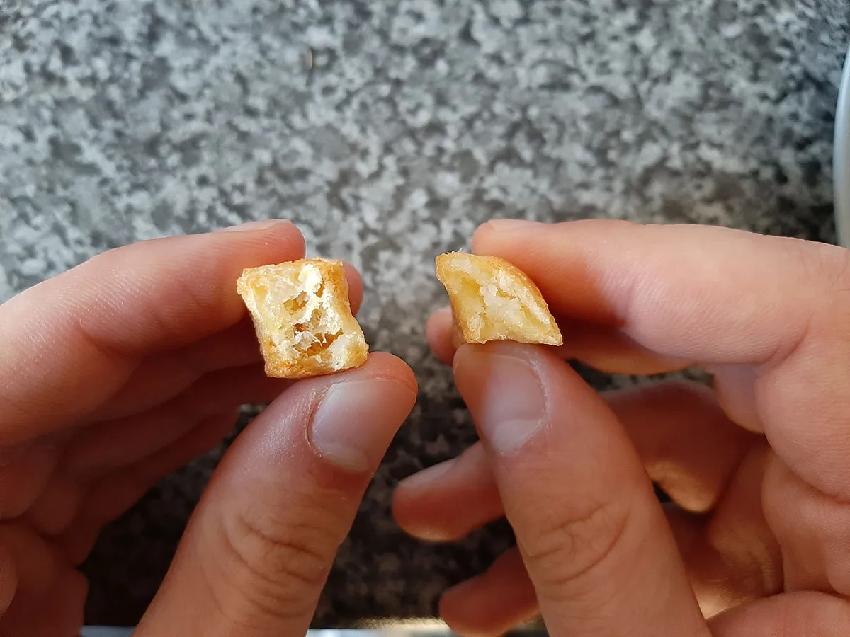 The inside of two oven chips, air-fried (left) and baked (right)