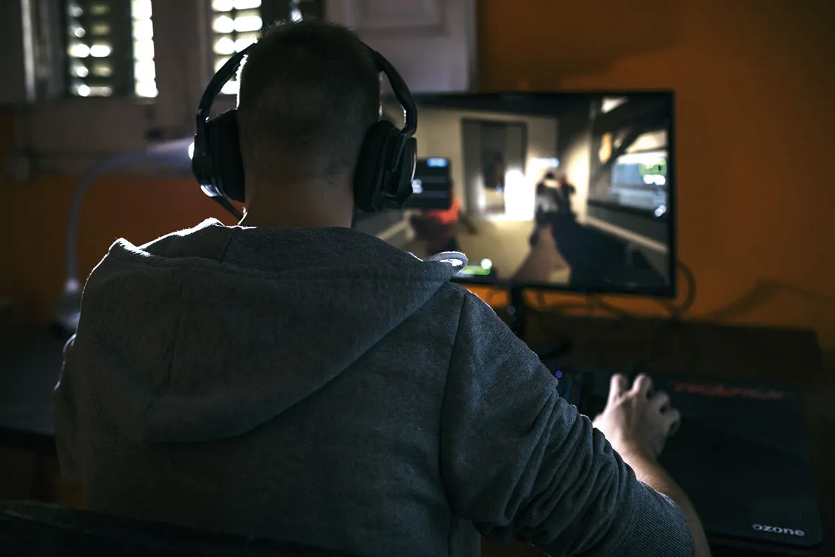 Person playing a video game on a computer