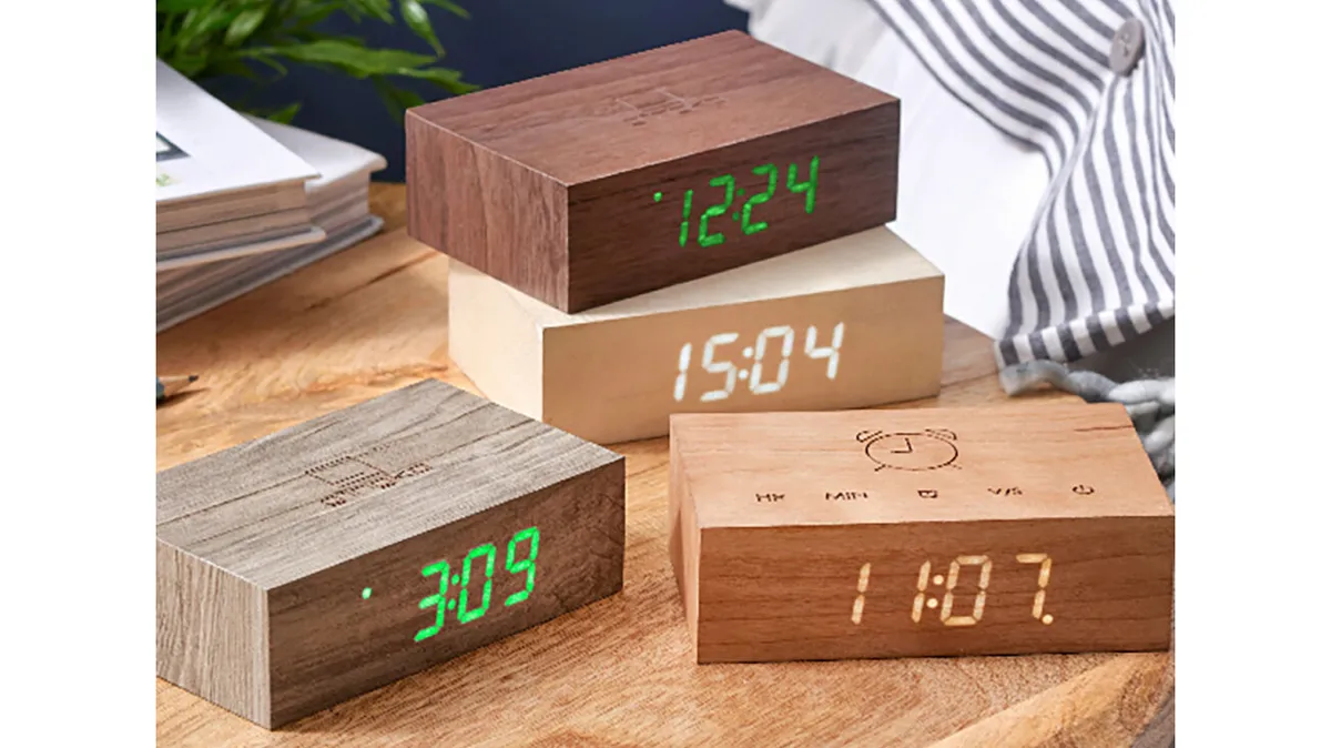 Gingko Flip Click Clocks on a wooden table
