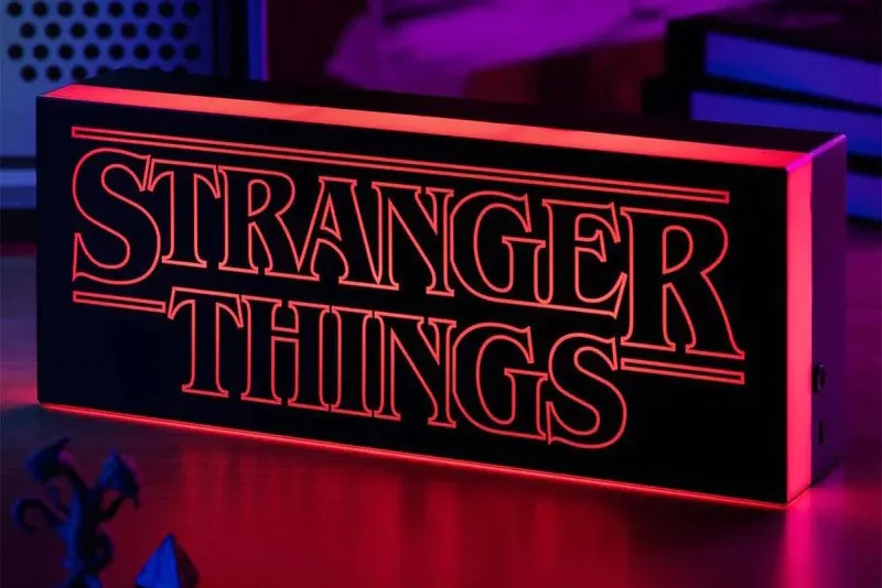 Stranger Things logo desk light in a dark room