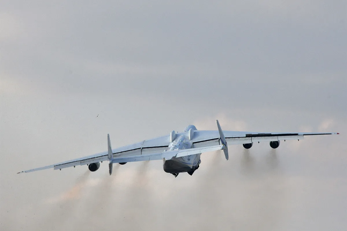 The worlds largest aircraft, the Antonov An-225 Mriya cargo aeroplane, takes off from the Antonov plant's airdrome in Gostomel, some 30 kilometres from Kiev on April 3, 2018. - The aircraft is heading to the German city of Leipzig from where it will conduct its first commercial flight following checks. (Photo by GENYA SAVILOV / AFP) (Photo by GENYA SAVILOV/AFP via Getty Images)