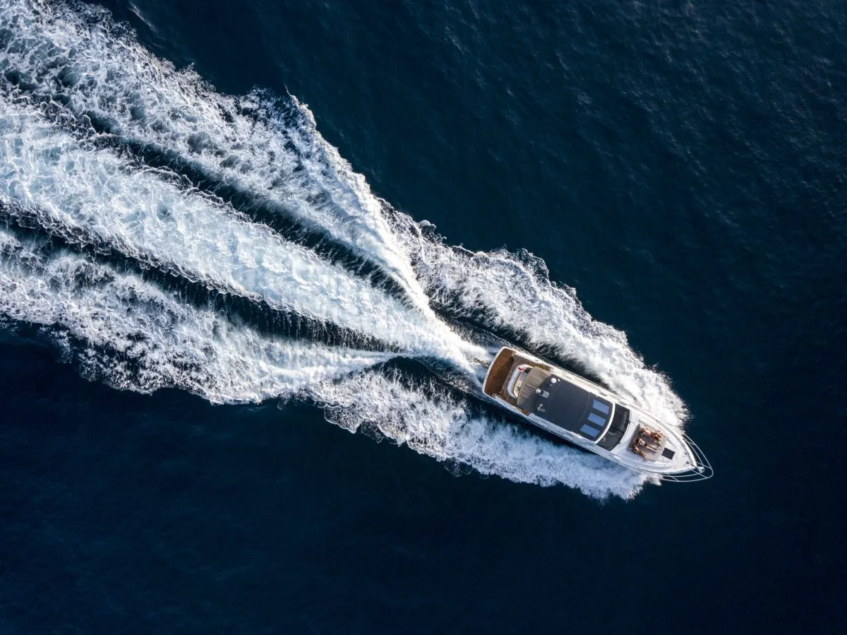 An aerial of a luxury motor yacht on a sunny day in the Mediterranean sea