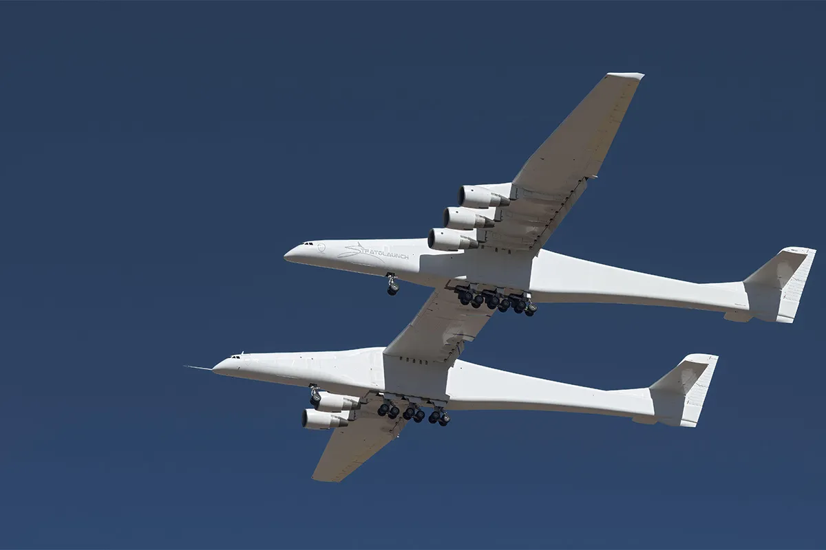Huge double-winged plane in blue sky