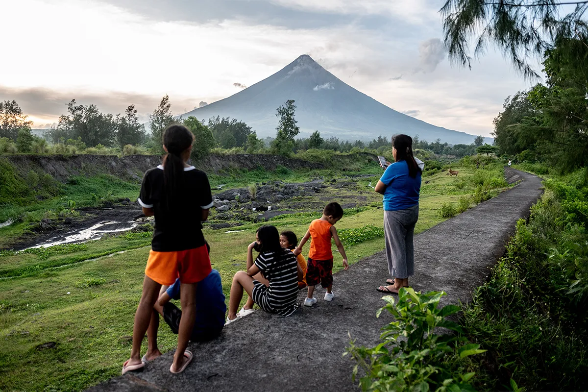 People look at the Mayon Volcano which remains under alert level 3, in Legazpi, Albay province, Philippines, on June 13, 2023. (Photo by Lisa Marie David/NurPhoto via Getty Images)