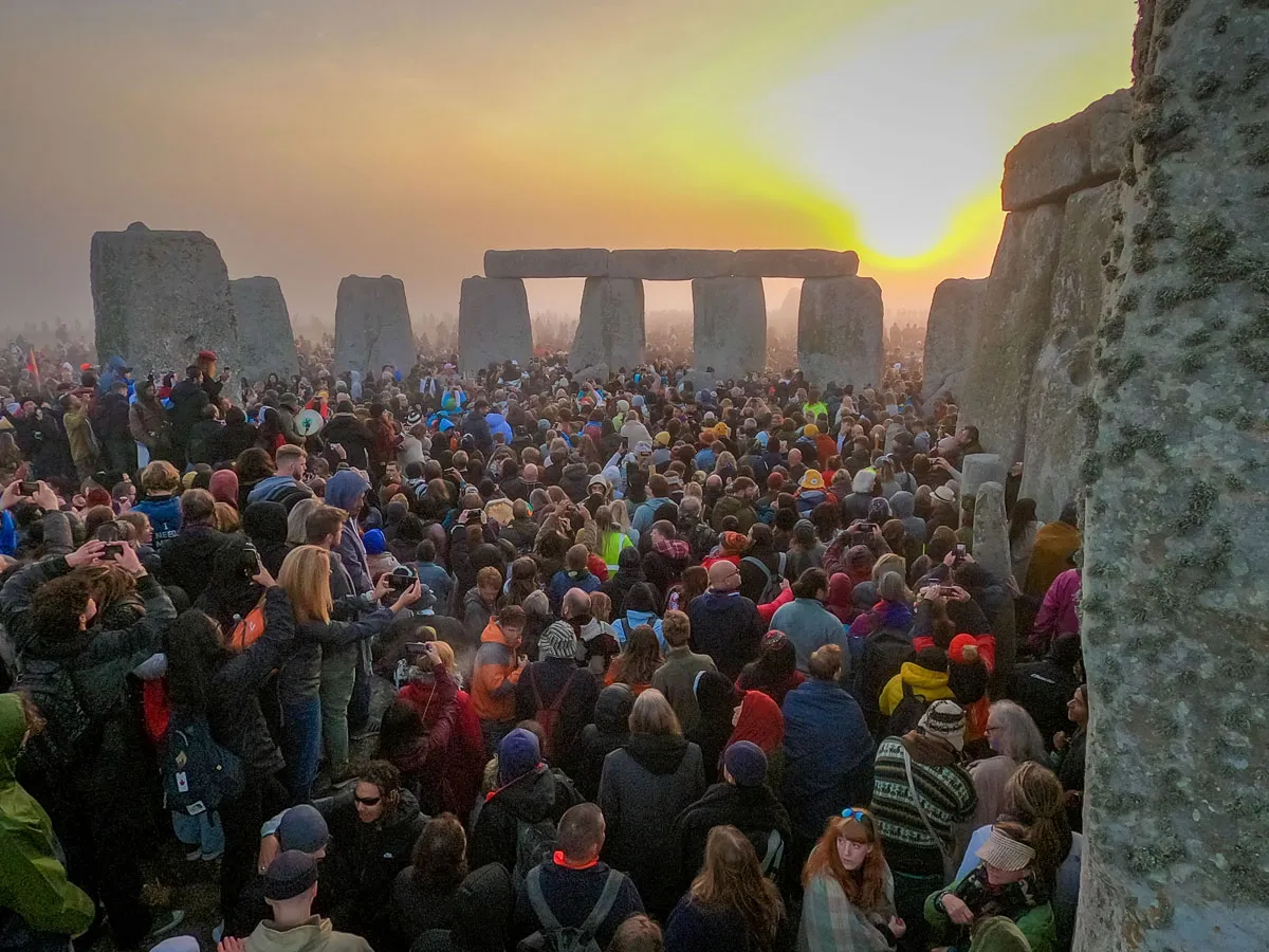 People gather for sunrise at Stonehenge