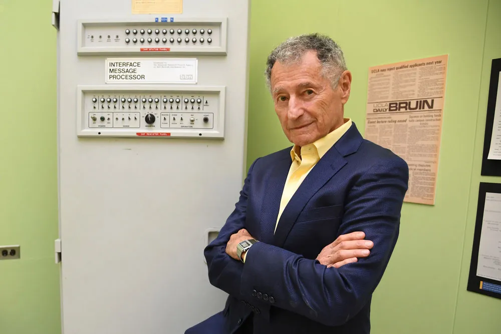 Leonard Kleinrock poses beside the first Interface Message Processor (IMP) in the lab where the first internet message was sent, at the University of California Los Angeles. Photo credit: Robyn Beck/AFP via Getty Images
