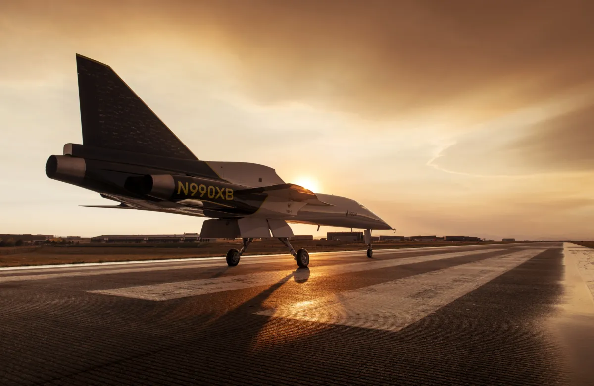 A supersonic aircraft on the runway in the sunset
