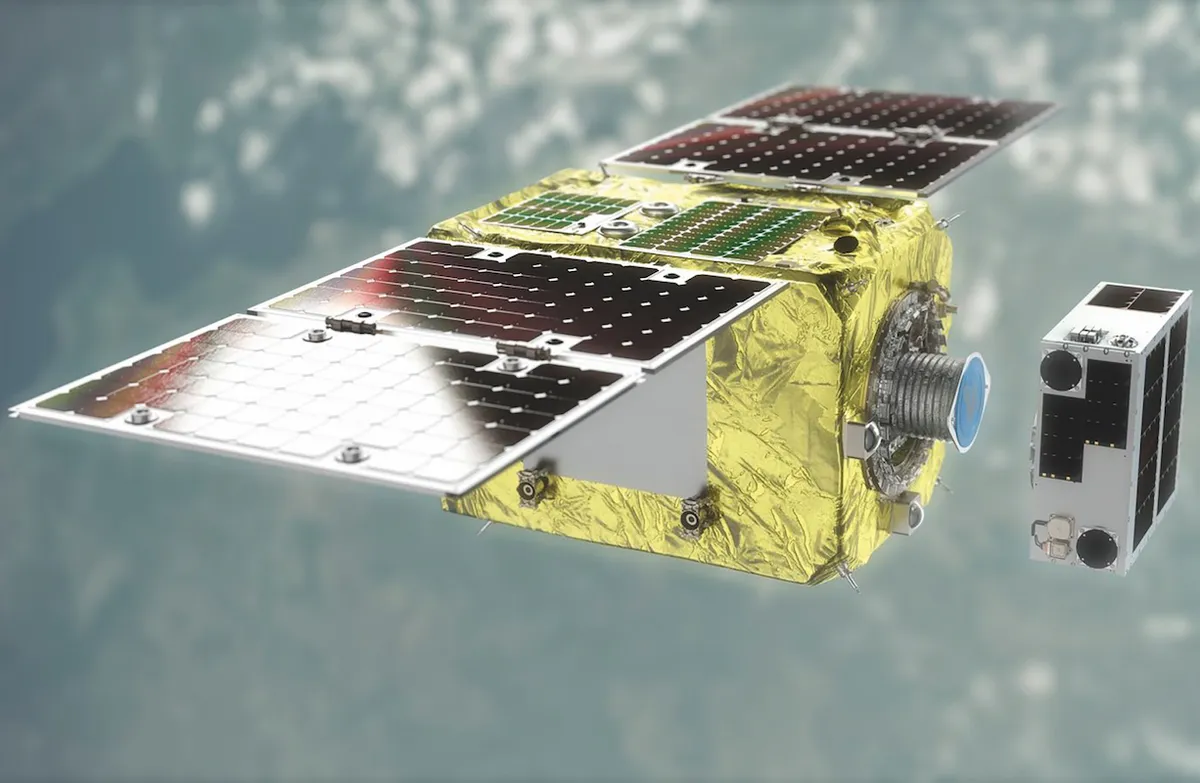 An illustration of the ELSA-d spacecraft, mid-mission, about to collect a piece of space debris