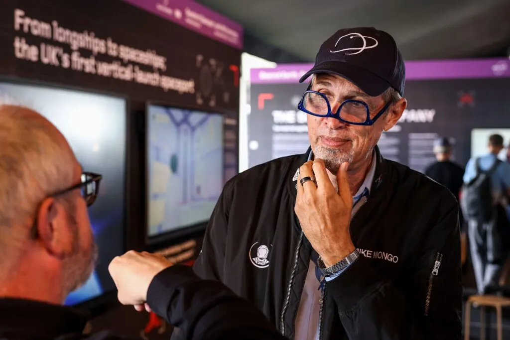 Astronaut trainer Mike Mongo wearing his glasses upside down with a cap on his head. Mongo is supporting the education programme for the spaceport