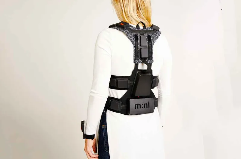 Back view of woman wearing the NotImpossible vest with straps tied up
