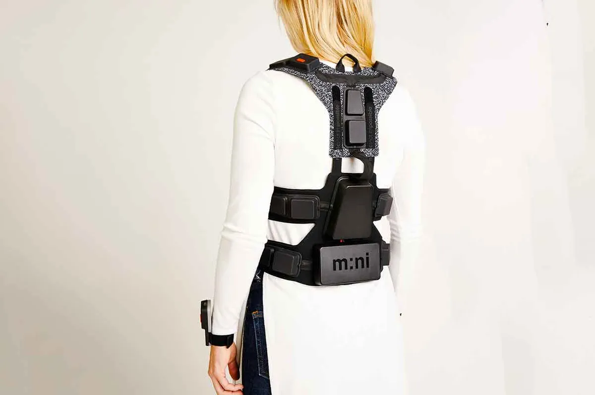 Back view of woman wearing the NotImpossible vest with straps tied up