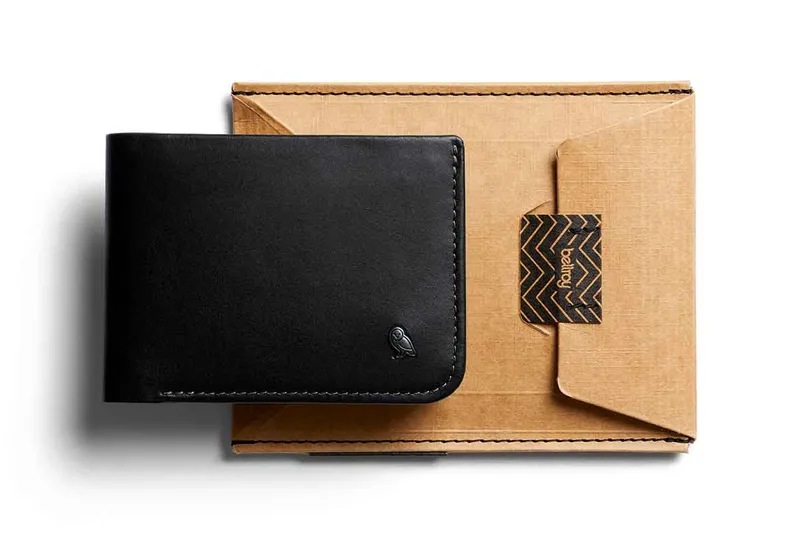 Bellroy Black wallet sitting on top of brown packaging