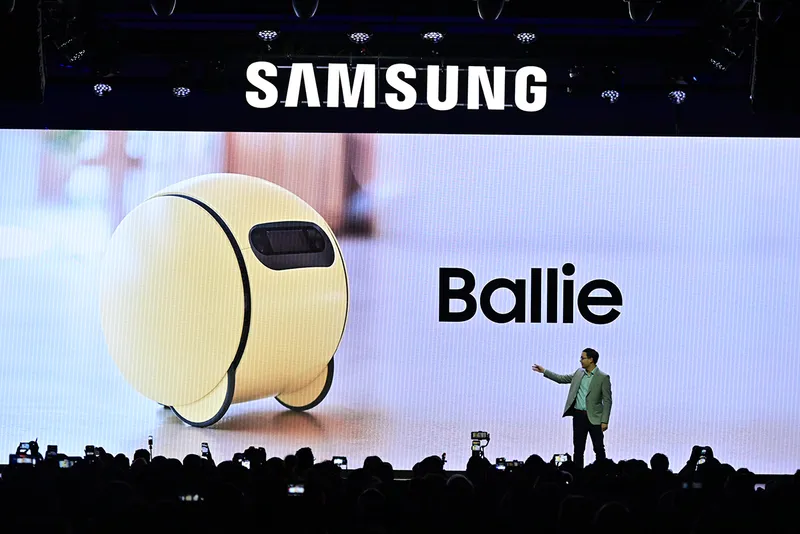 Samsung's press announcement at CES with a large screen showing the Ballie product behind.