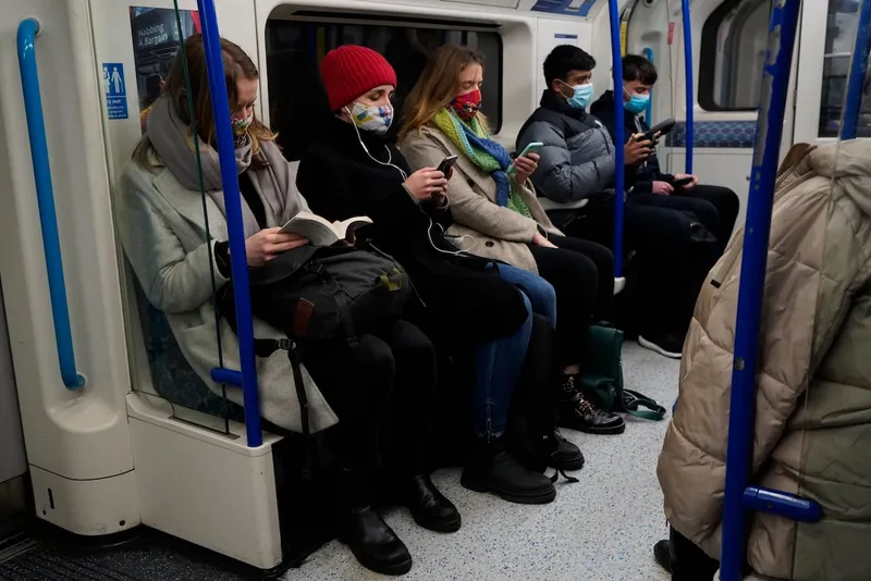 Commuters on London Underground wearing masks during the COIVD pandemic