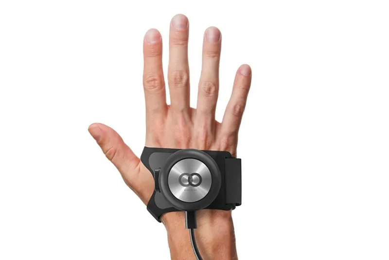 A hand is stretched out with the GyroGlove attachment on it