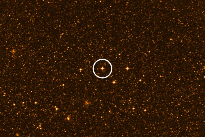 Circled Orange star deep in space