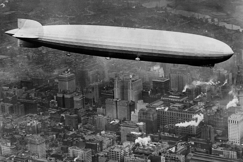 airship flying over New York skyscrapers
