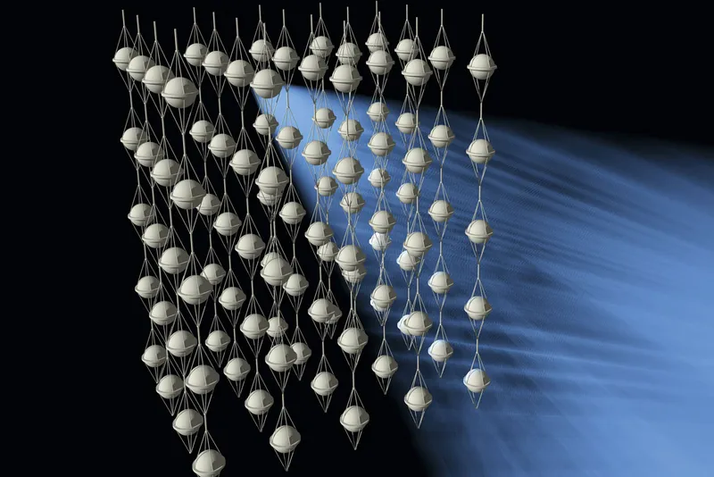 A graphic depicting many spherical, grey detectors that are linked vertically by strings. 
