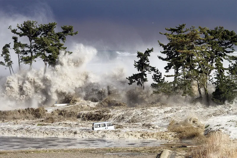 huge waves crash over trees and cars