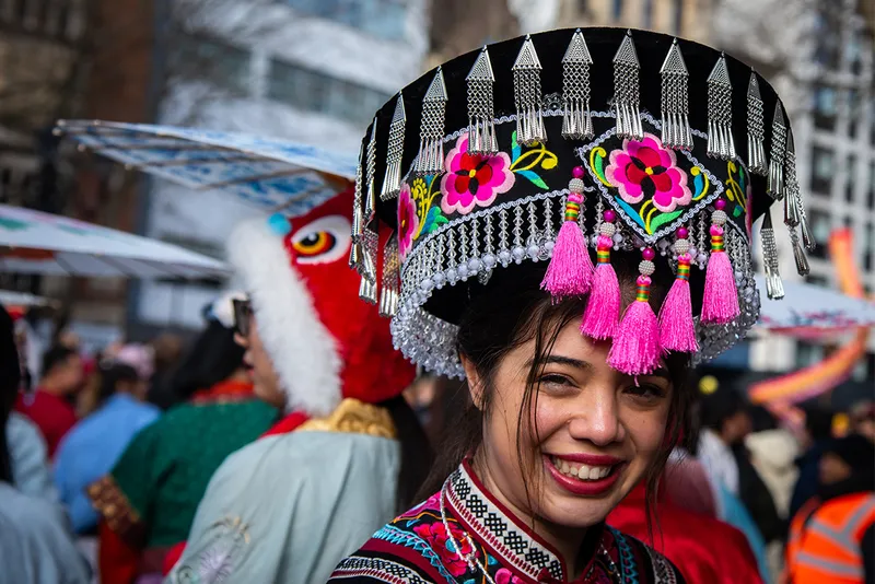 Smiling woman wearing traditional hat