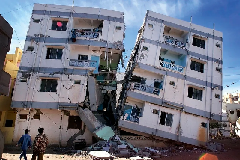 Two buildings toppling due to an Earthquake
