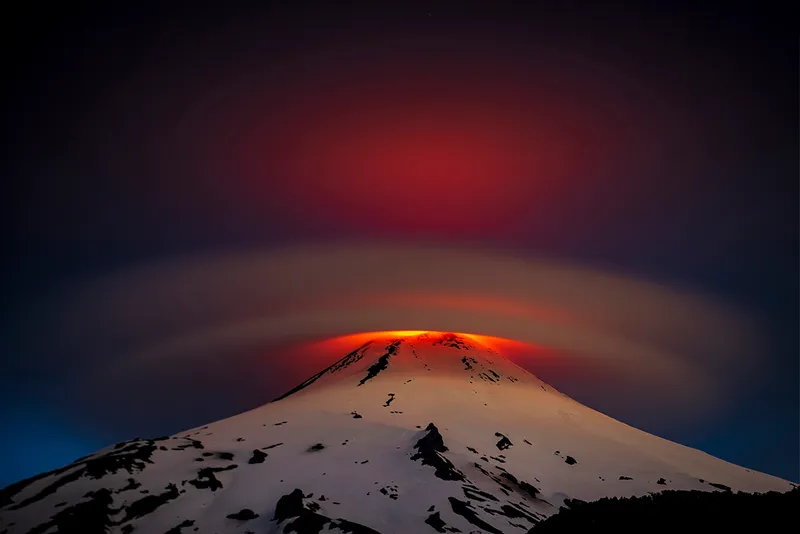 cloud over a glowing volcano.