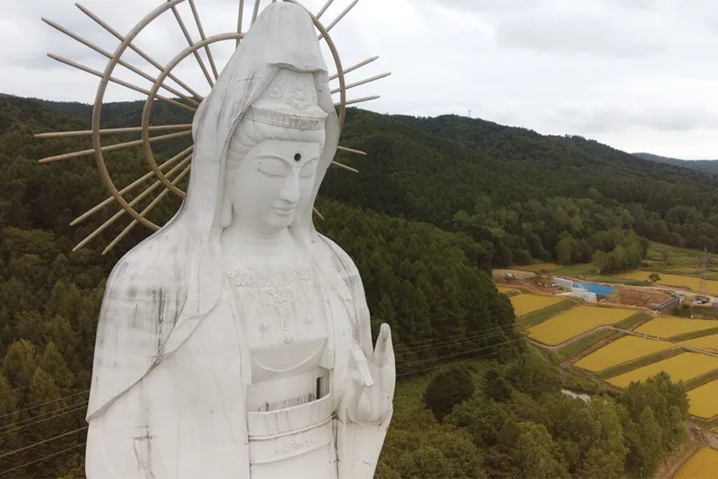 Close up drone shot of huge statue.