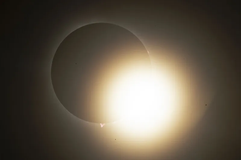 Total solar eclipse with bright ball of light.