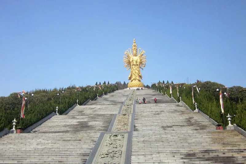 flights of steps with gold statue at the top.