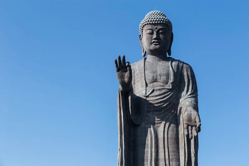 Huge buddha statue with blue sky.