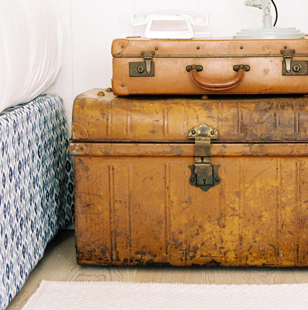 An image of stacked-up antique trunks at the Trevose Harbour House in St Ives, Cornwall