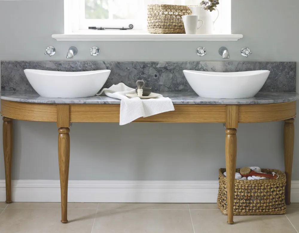 This bespoke twin washstand (from £1,999) by Podesta features an oak stand with hand-turned legs and a Bianco Eclipsia marble surface